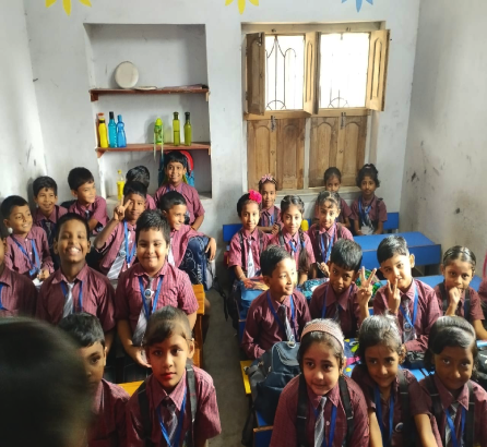 Students in uniform forming parallel lines outside the classroom at ANGEL HEART PUBLIC School, participating in a morning assembly or activity.